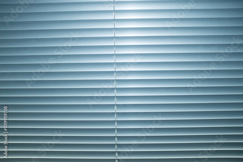 View of window with silver metallic blinds with hard direct flashlight photo