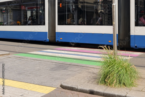 Public transport and Rainbow crossroad in Amsterdam, Netherlands 