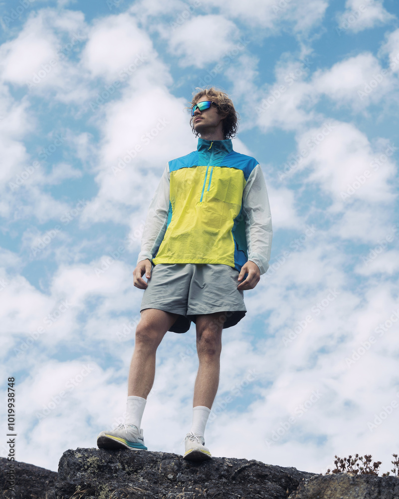 Speedy Athlete Running Up Hill Against Cloudy Sky Speedy Athlete Running Up Hill Against Cloudy Sky