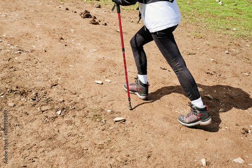 Blonde young woman trekking photo