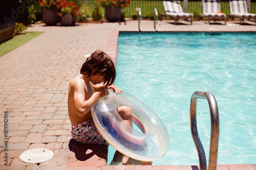 Poolside Inflating floating photo