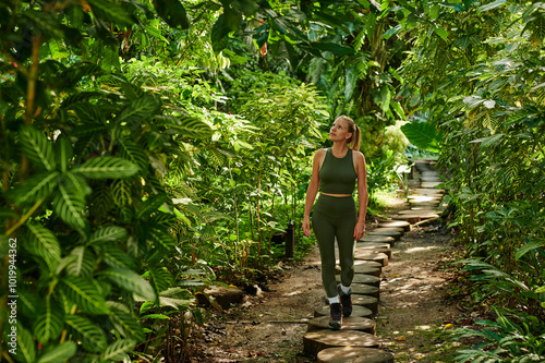 Blonde woman exploring rainforest