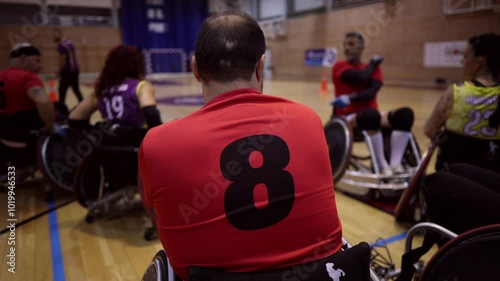 Wallpaper Mural Wheelchair basketball team listening to their coach during a timeout in a gym Torontodigital.ca