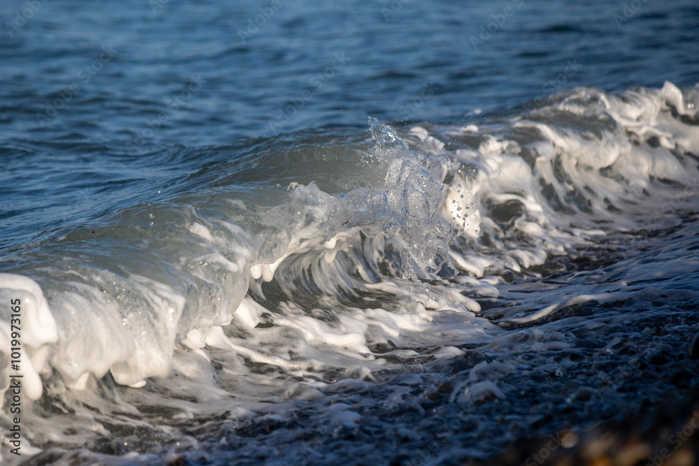 Seashore, small stones, sea wave. Marine background. Seashore, small stones, sea wave. Marine background.
