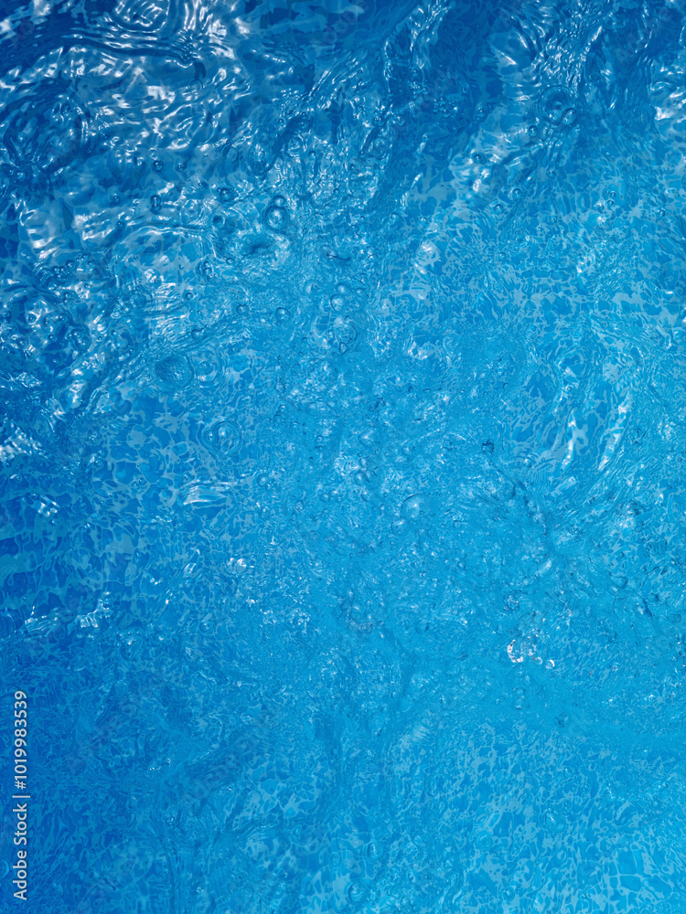 Close-up of swimming pool water with blue tiles Close-up of swimming pool water with blue tiles