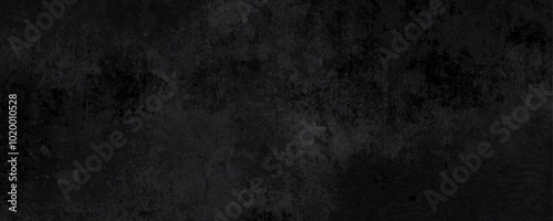 Black rough grunge texture ideal for creating a vintage or industrial look in graphic design and posters 