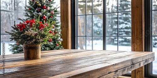 Cozy winter scene with a wooden table and a festive Christmas tree in the background.