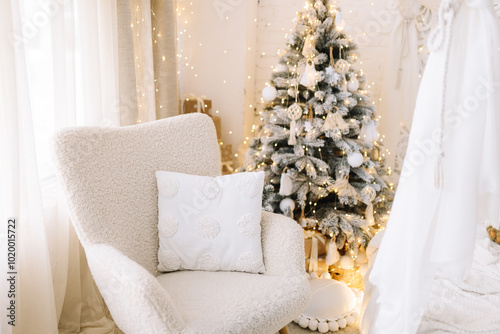 A warm festive corner with a Christmas tree and garlands photo