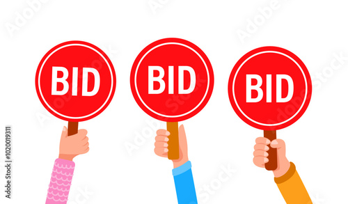 People holding bid paddles making offers at an auction