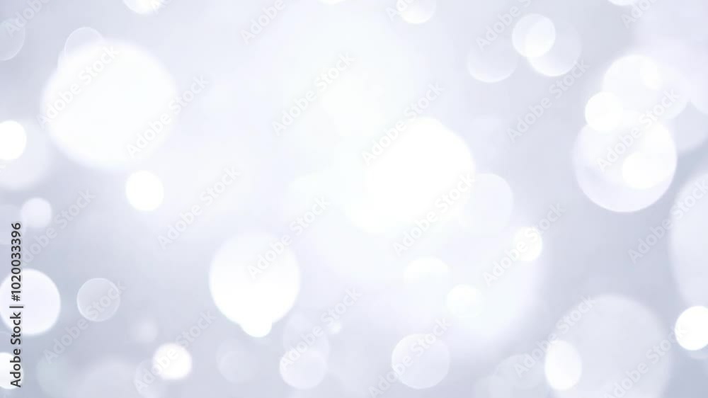 Soft white bokeh lights glowing against a blurred background