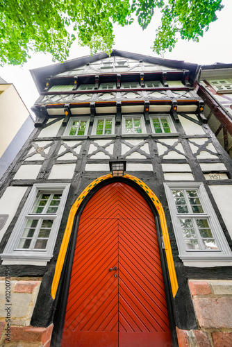 Old half-timbered house with a red gate in Bad Hersfeld.
 photo