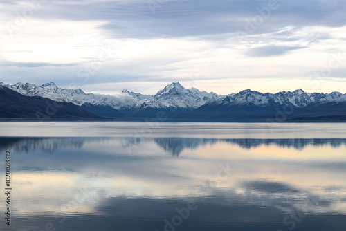 Panoramic view of Lake Pukaki with its famous blue waters and the Southern Alps. The untouched wilderness is showcased here, capturing the tranquil beauty of the region.