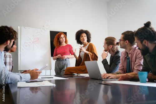 Happy african american female leader holding negotiations meeting with friendly diverse colleague