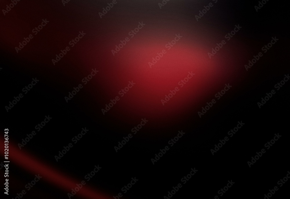 A dark, abstract background with a grainy gradient of red and black. A dark, abstract background with a grainy gradient of red and black.
