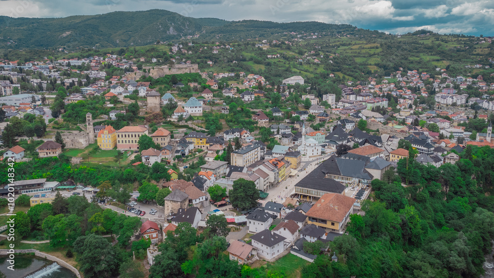 Aerial drone view of city of Jajce in Bosnia and hercegovina, known for its birthplace of Jugoslavia. Visible main square and surrounding hills Aerial drone view of city of Jajce in Bosnia and hercegovina, known for its birthplace of Jugoslavia. Visible main square and surrounding hills