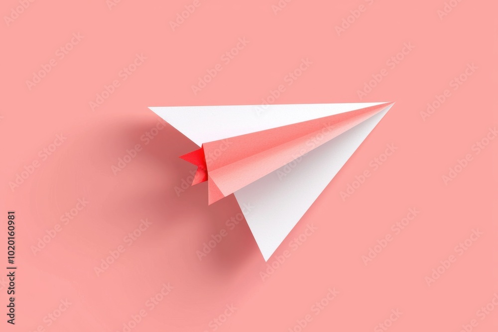 A vibrant paper airplane against a soft coral background, symbolizing creativity, flight, and imagination in design. A vibrant paper airplane against a soft coral background, symbolizing creativity, flight, and imagination in design.