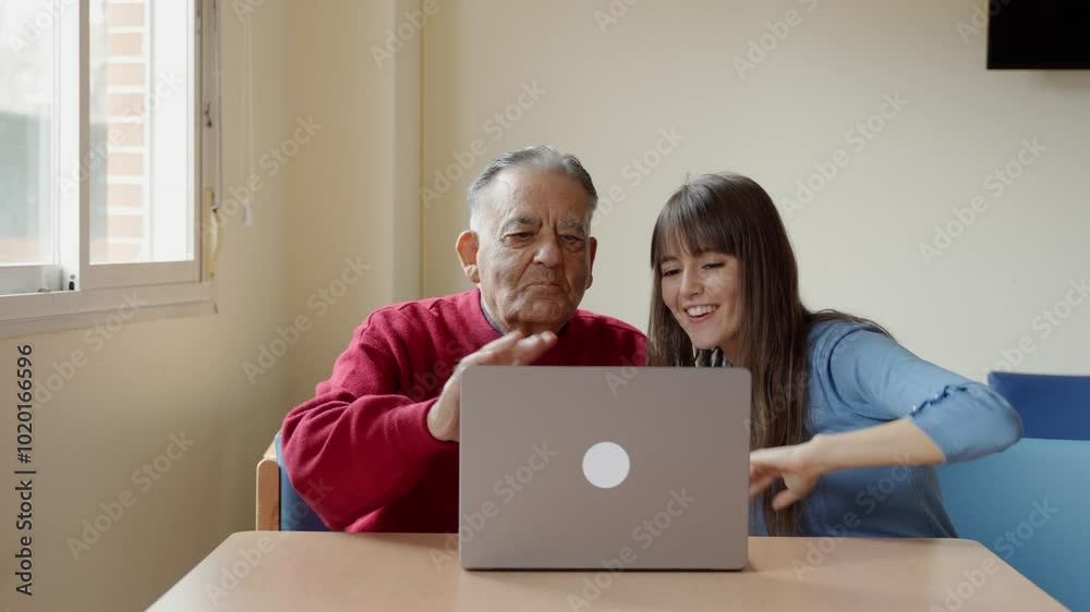 Nurse assisting an elderly man with laptop usage in a nursing home, promoting digital literacy and communication skills Nurse assisting an elderly man with laptop usage in a nursing home, promoting digital literacy and communication skills