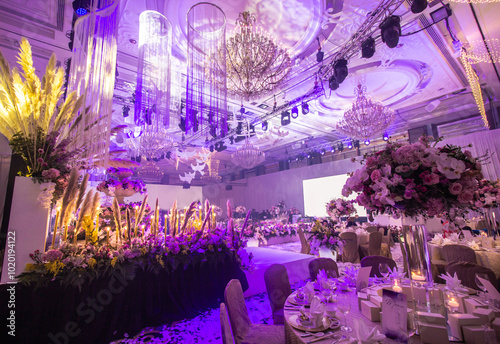 luxury color theme wedding solemnisation dinner flower florist , dinnerware banquet, cloth and stage lighting decoration design in premium hotel ballroom and beautiful beach event