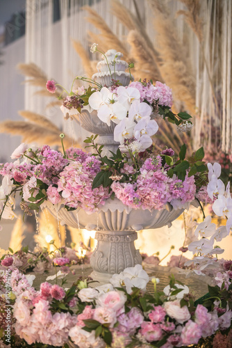 luxury color theme wedding solemnisation dinner flower florist , dinnerware banquet, cloth and stage lighting decoration design in premium hotel ballroom and beautiful beach event