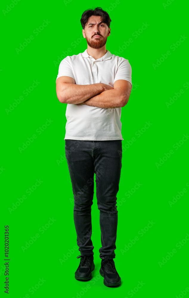 A young man with a beard showing a serious expression against a vibrant green background A young man with a beard showing a serious expression against a vibrant green background