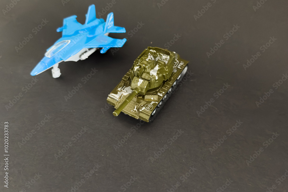 Toy fighter Plane and a toy tank Toy fighter Plane and a toy tank