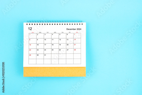 December 2024, Monthly desk calendar for 2024 year on blue background.