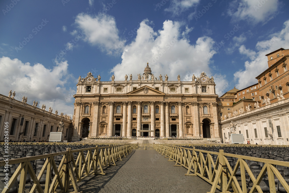 Obraz premium View of St. Peter's Basilica in the Vatican and the square in front of it with rows of chairs for the faithful