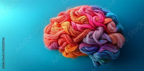 A vibrant, creative representation of a brain crafted from colorful yarn, ideal for Mental Health Day awareness campaigns and neurodiversity events.
