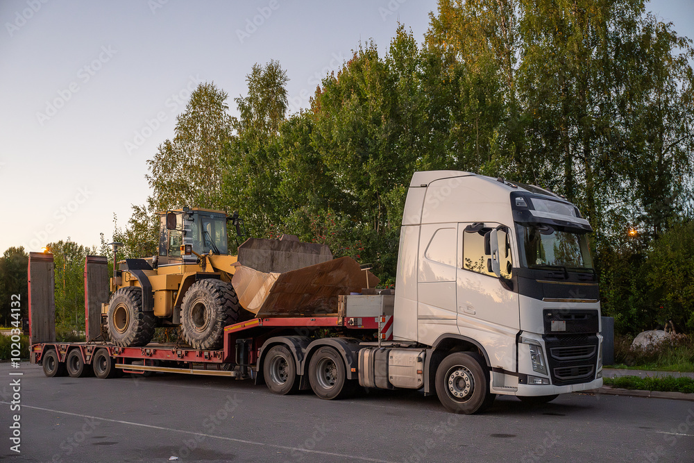 Heavy-Duty truck transporting agricultural farm tractor Heavy-Duty truck transporting agricultural farm tractor
