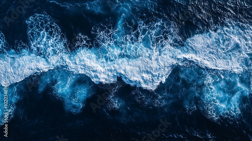 Aerial View of Ocean Waves: A top-down view of ocean waves, highlighting the patterns and movement of the sea from above.