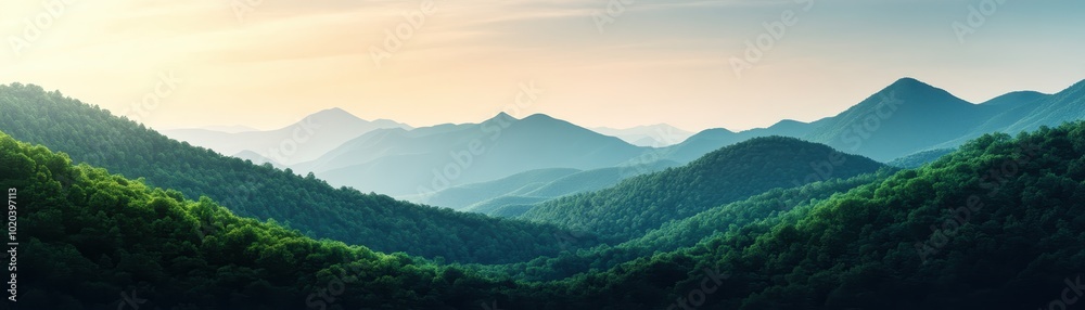 Naklejka premium Serene Mountain Landscape with Rolling Green Hills and Layered Peaks at Sunrise