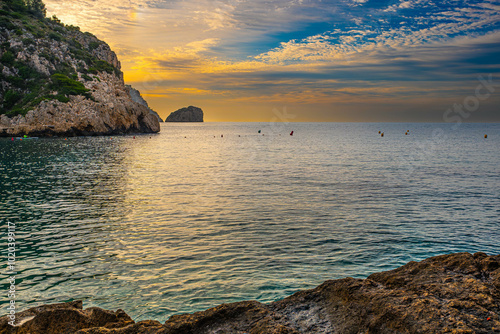 The Granadella cove with crystal-clear waters in Javea, Alicante, in the Spanish Mediterranean photo