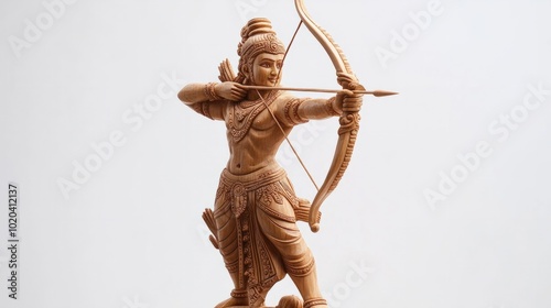 A beautifully hand-carved wooden statue of Lord Rama standing tall with his bow, with fine details on his clothing and arrows, representing heroism and virtue, crafted from polished teak wood photo