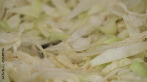 Fry cabbage in a frying pan.