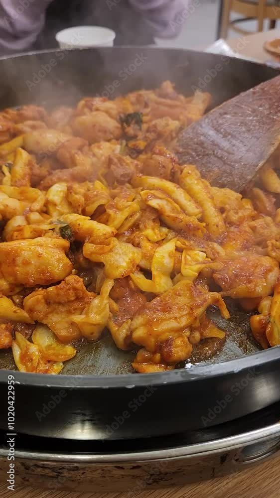 Cooking dakgalbi (spicy stir-fried chicken) 