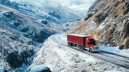 Semi-truck winding its way along a narrow, snowy mountain path with rugged terrain and snow banks.