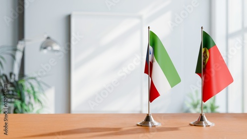 FLAGS OF EQUATORIAL GUINEA AND PORTUGAL ON TABLE