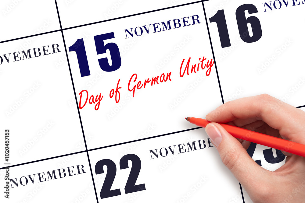 November 15. Hand writing text Day of German Unity on calendar date. Save the date. November 15. Hand writing text Day of German Unity on calendar date. Save the date.