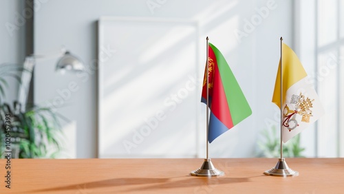 FLAGS OF ERITREA AND VATICAN ON TABLE