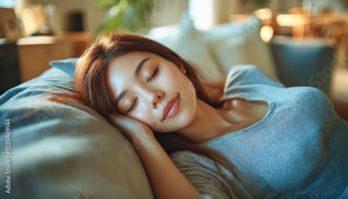 Young woman sleeping peacefully on couch at home