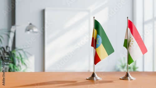 FLAGS OF ETHIOPIA AND TAJIKISTAN ON TABLE photo