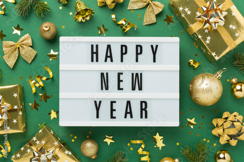 Happy New Year with decor on color background, top view