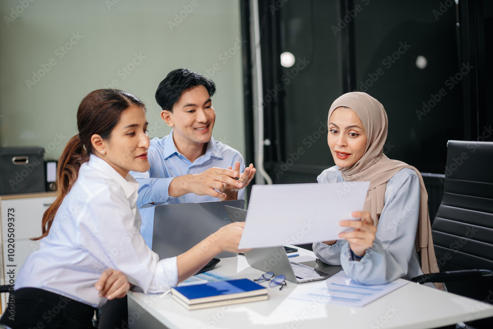 Office colleagues have a casual discussion. During a meeting in a conference room, a group of business teem Office colleagues have a casual discussion. During a meeting in a conference room, a group of business teem