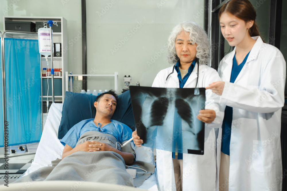 Doctor talking with man patient for monitoring and check up after surgery. doctor touching patient hand and consoling. Doctor talking with man patient for monitoring and check up after surgery. doctor touching patient hand and consoling.