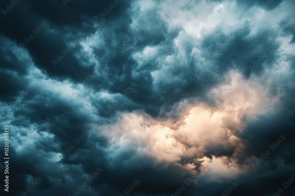 Dramatic sky with rolling clouds illuminated by golden light at dusk Dramatic sky with rolling clouds illuminated by golden light at dusk
