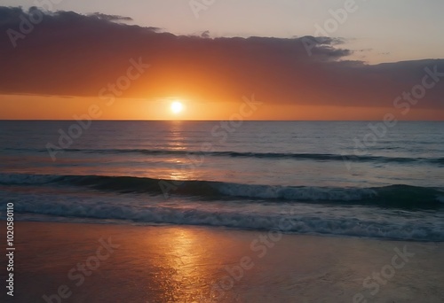 A vibrant sunset paints the sky orange over a calm ocean.