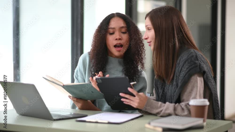 Businesswoman leading team meeting and using tablet and laptop computer with financial Businesswoman leading team meeting and using tablet and laptop computer with financial