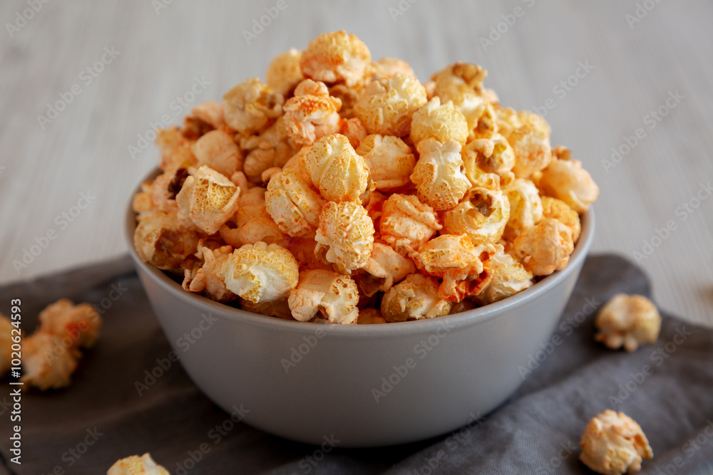 Homemade Crunchy Chicago-Style Popcorn with Caramel and Cheese in a Bowl, side view. Homemade Crunchy Chicago-Style Popcorn with Caramel and Cheese in a Bowl, side view.