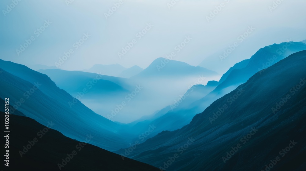 Obraz premium Serene minimalist mountain landscape with layered silhouettes and mist