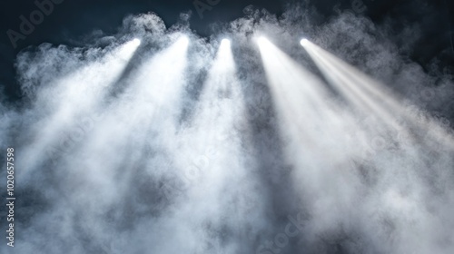 Three Bright Spotlights Shining Through Smoke